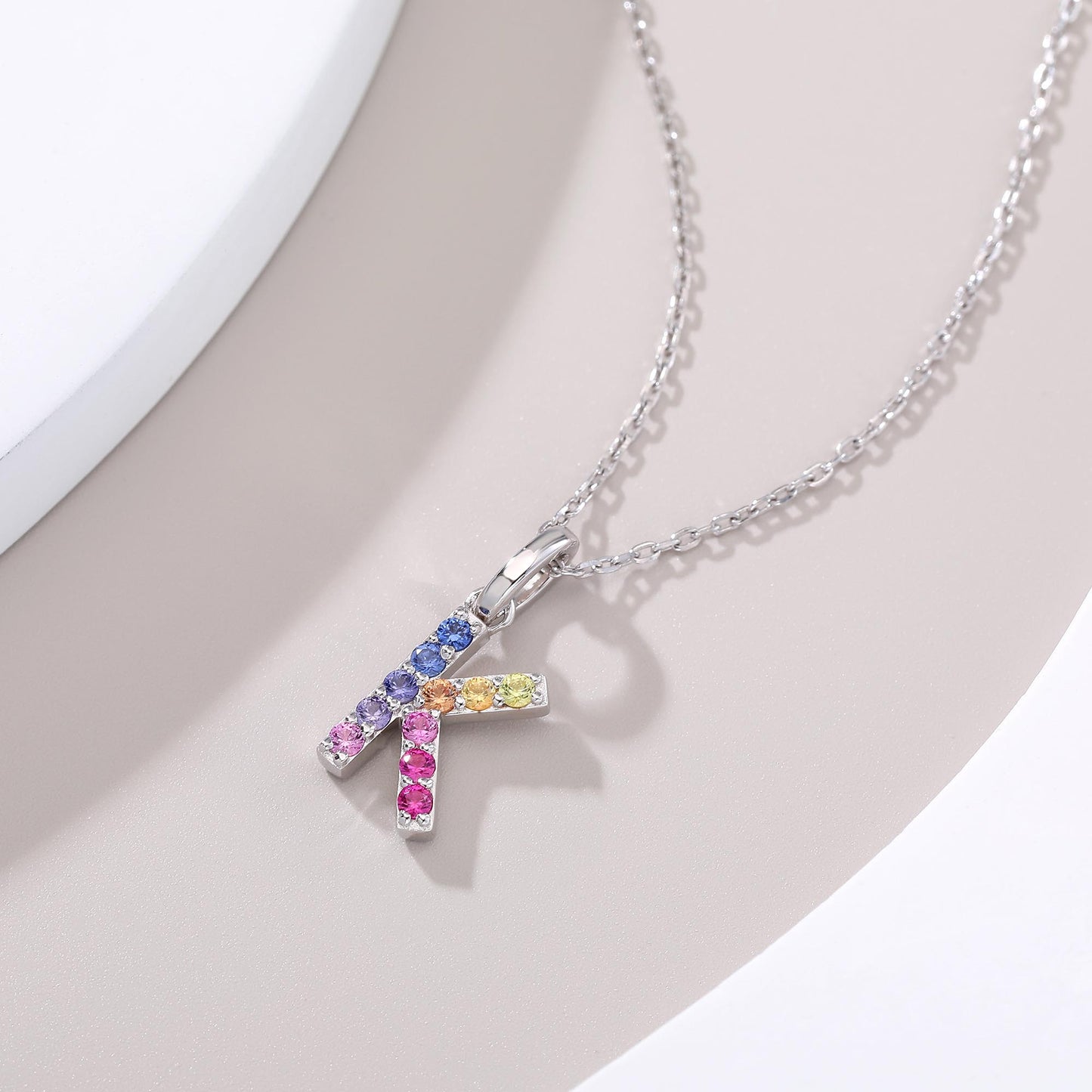 Vibrant lab-grown sapphire "K" pendant | Sterling silver initial necklace