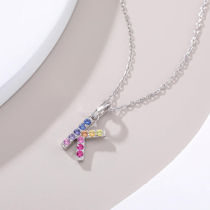 Vibrant lab-grown sapphire "K" pendant | Sterling silver initial necklace