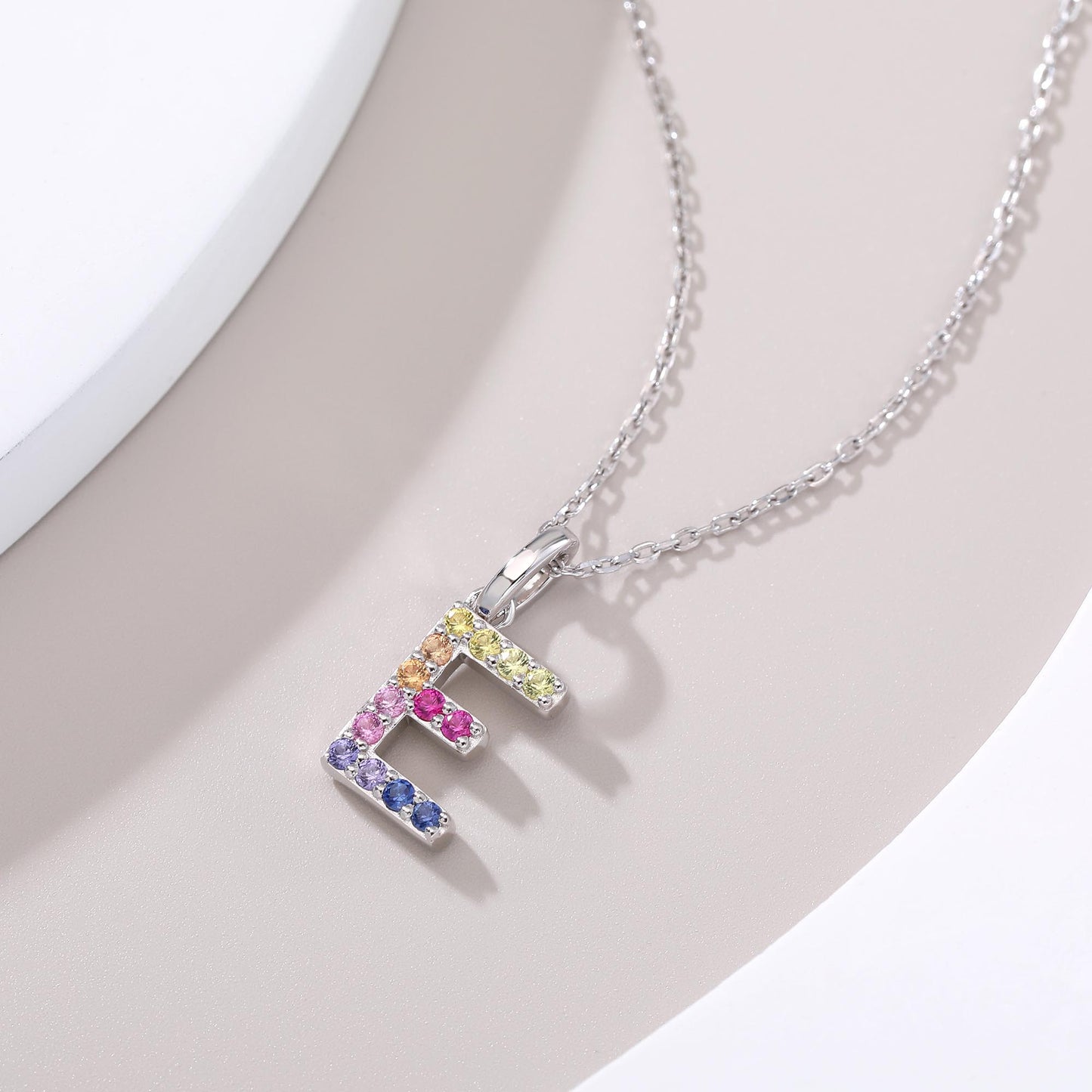 Vibrant lab-grown sapphire "E" pendant | Sterling silver initial necklace