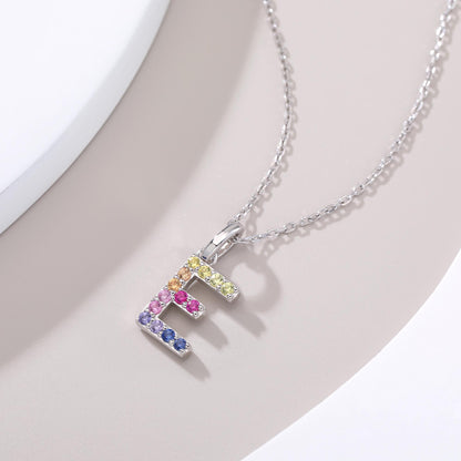 Vibrant lab-grown sapphire "E" pendant | Sterling silver initial necklace